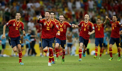Spain's players celebrate after winning the penalty shootout of their Confederations Cup semi-final soccer match against Italy at the Estadio Castelao in Fortaleza