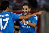 Real Madrid's Karim Benzema (R) celebrates with teammate Alvaro Arbeloa after scoring a goal against Granada during their Spanish first division soccer match at Los Carmenes stadium in Granada