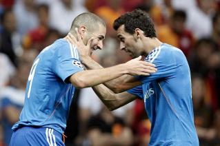 Real Madrid's Benzema celebrates a goal with team mate Arbeloa against Galatasaray during their Champions League soccer match in Istanbul