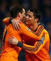 Real Madrid's Bale and Ronaldo celebrate Bale's goal against Schalke 04 during their Champions League soccer match in Gelsenkirchen