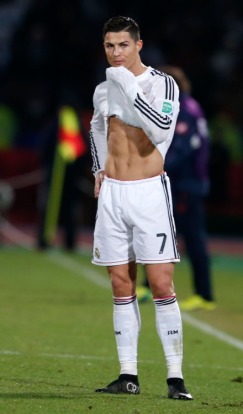 Cris lifting his jersey and showing us some abs