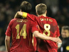Liverpool's Steven Gerrard, right, and Xabi Alonso trudge from the field after their 2-0 loss to Benfica in their Champion's League knock out round second leg soccer match at Anfield Stadium, Liverpool, England, Wednesday March 8, 2006. (AP Photo/Dave Thompson)