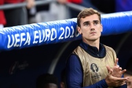 France's forward Antoine Griezmann sits on the sideline during the start of the Euro 2016 group A football match between France and Albania at the Velodrome stadium in Marseille on June 15, 2016. / AFP / FRANCK FIFE (Photo credit should read FRANCK FIFE/AFP/Getty Images)